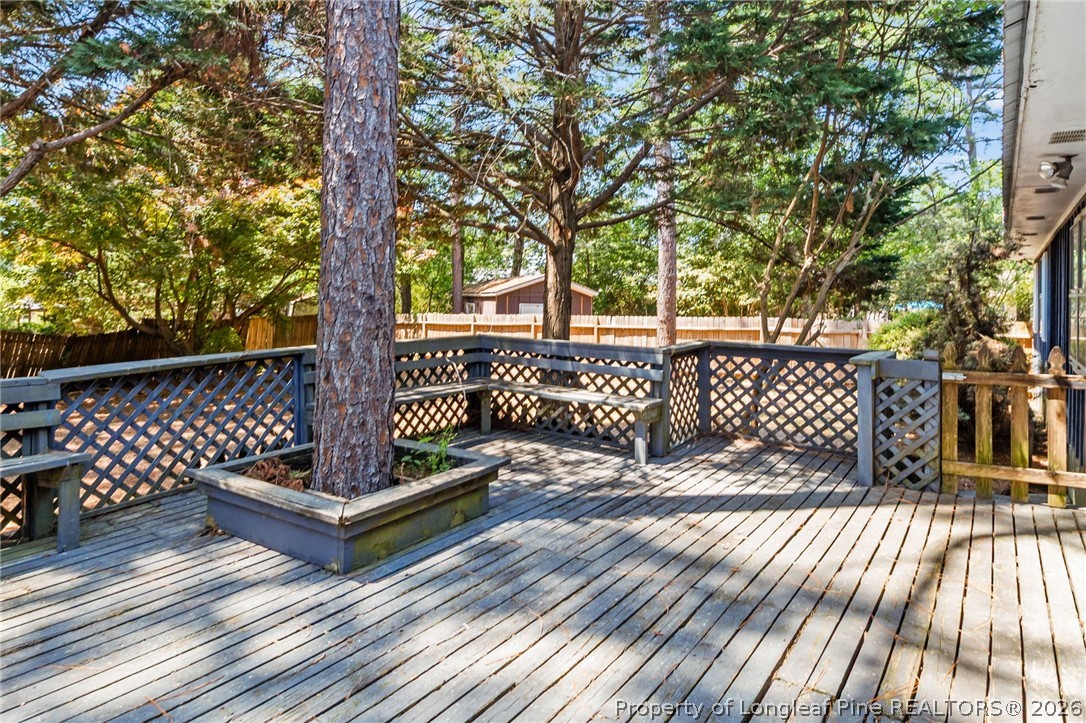 5605 MacGregor Court Fayetteville, NC 28304 - Photo 42 of 49 a view of wooden deck with a bench