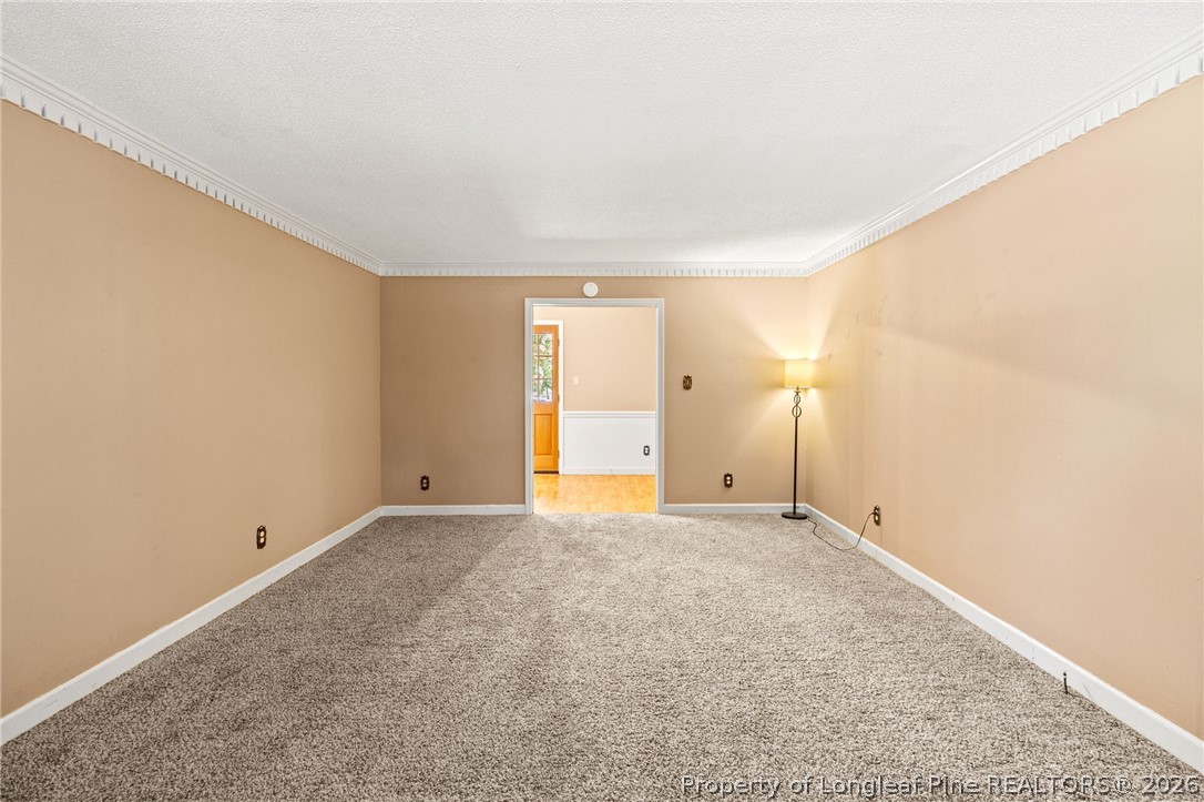 5605 MacGregor Court Fayetteville, NC 28304 - Photo 6 of 49 a view of an empty room with wooden floor