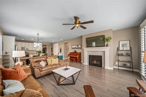 a living room with furniture fireplace and flat screen tv