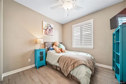 a bed sitting in a bedroom next to a window