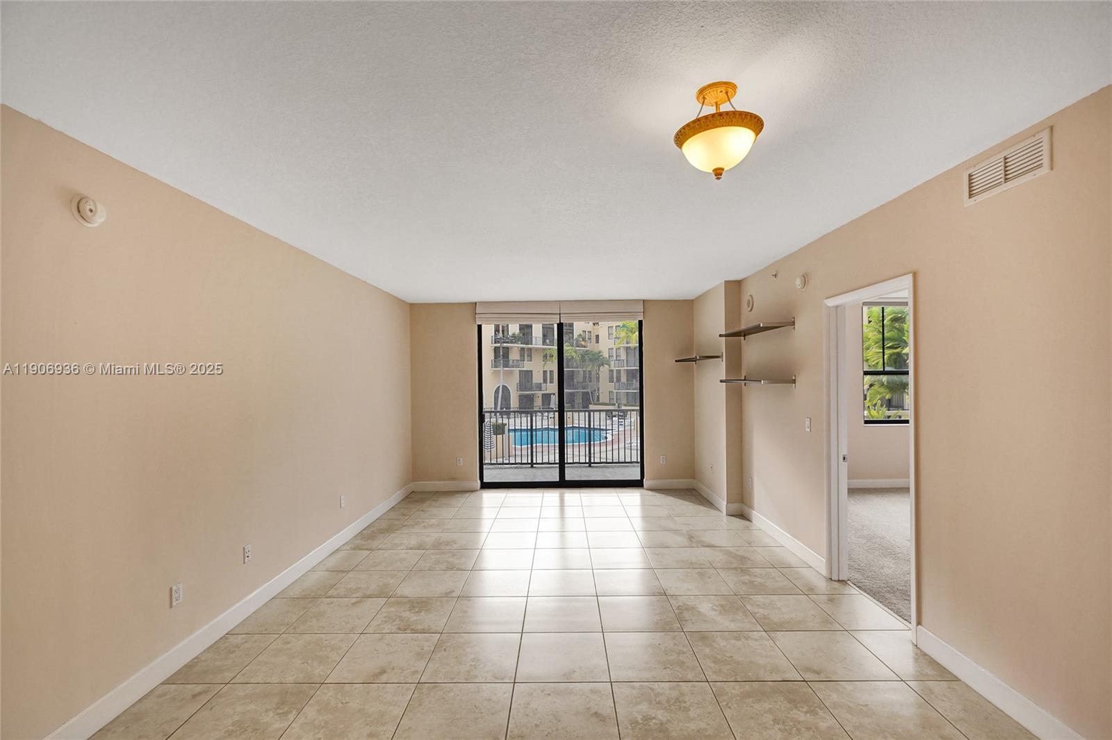 55 Merrick Way, Unit 619 Coral Gables, FL 33134 - Photo 11 of 40 a view of an empty room with a window