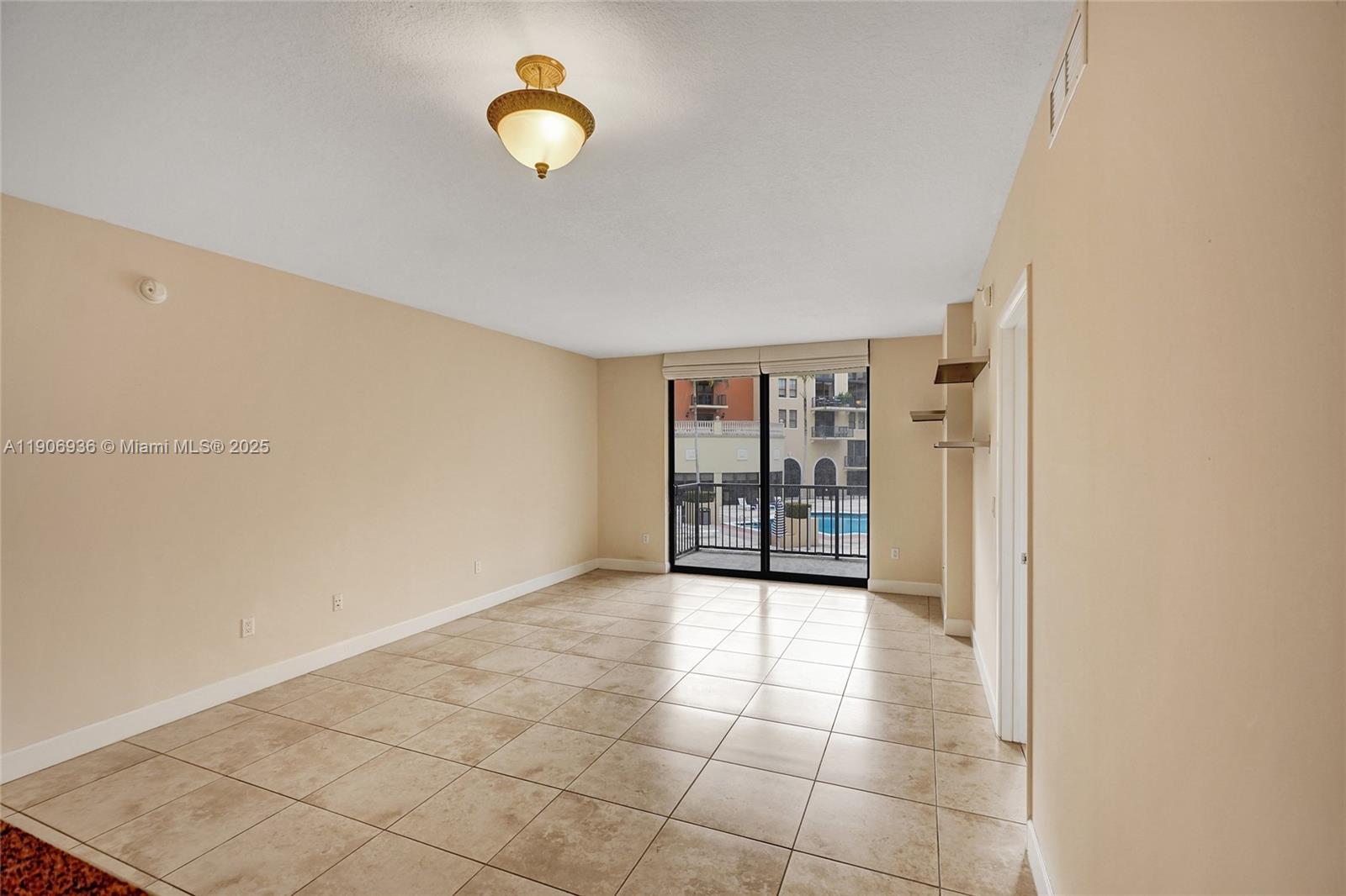 55 Merrick Way, Unit 619 Coral Gables, FL 33134 - Photo 12 of 40 a view of an empty room with a window