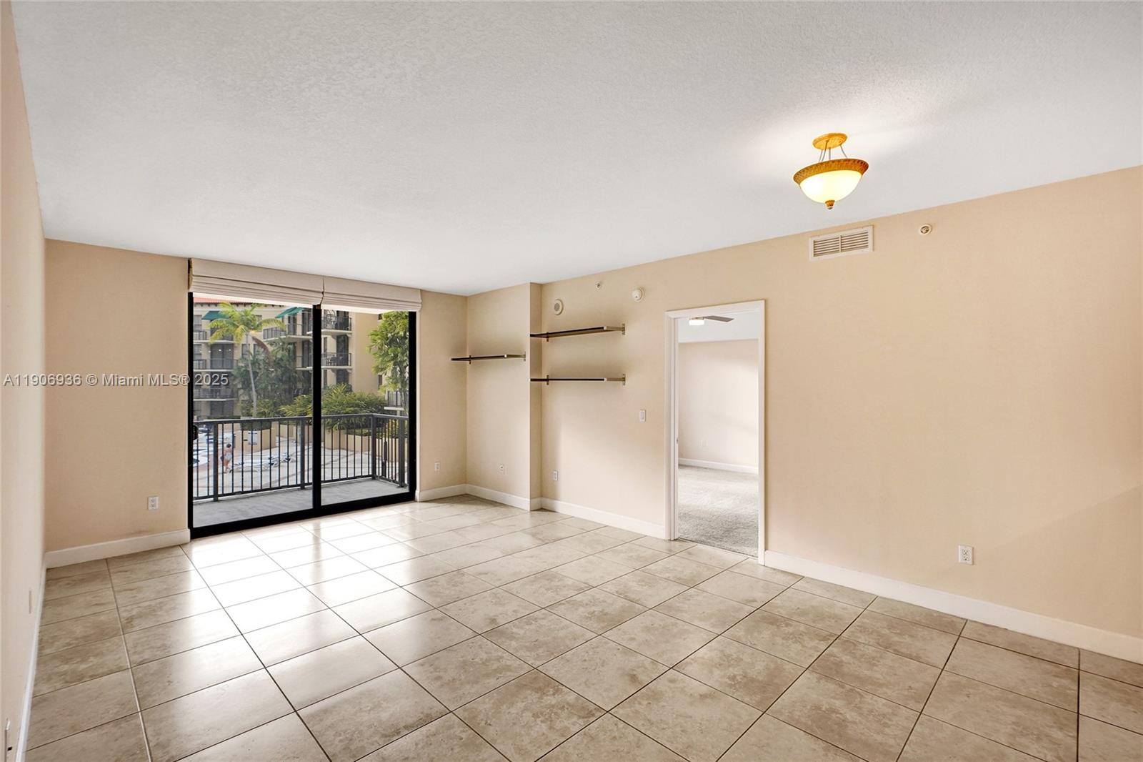 55 Merrick Way, Unit 619 Coral Gables, FL 33134 - Photo 14 of 40 a view of a kitchen with an empty space and window