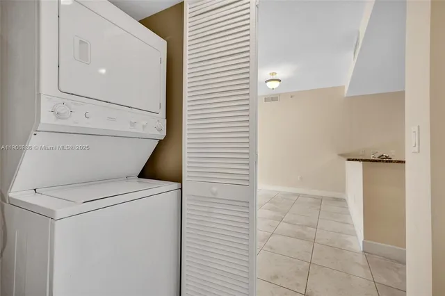 a view of storage and utility room with washer and dryer
