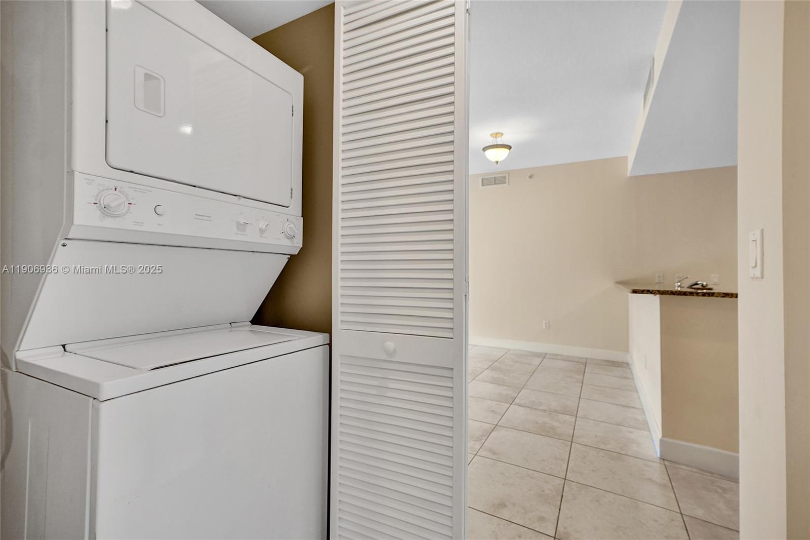 55 Merrick Way, Unit 619 Coral Gables, FL 33134 - Photo 15 of 40 a view of storage and utility room with washer and dryer