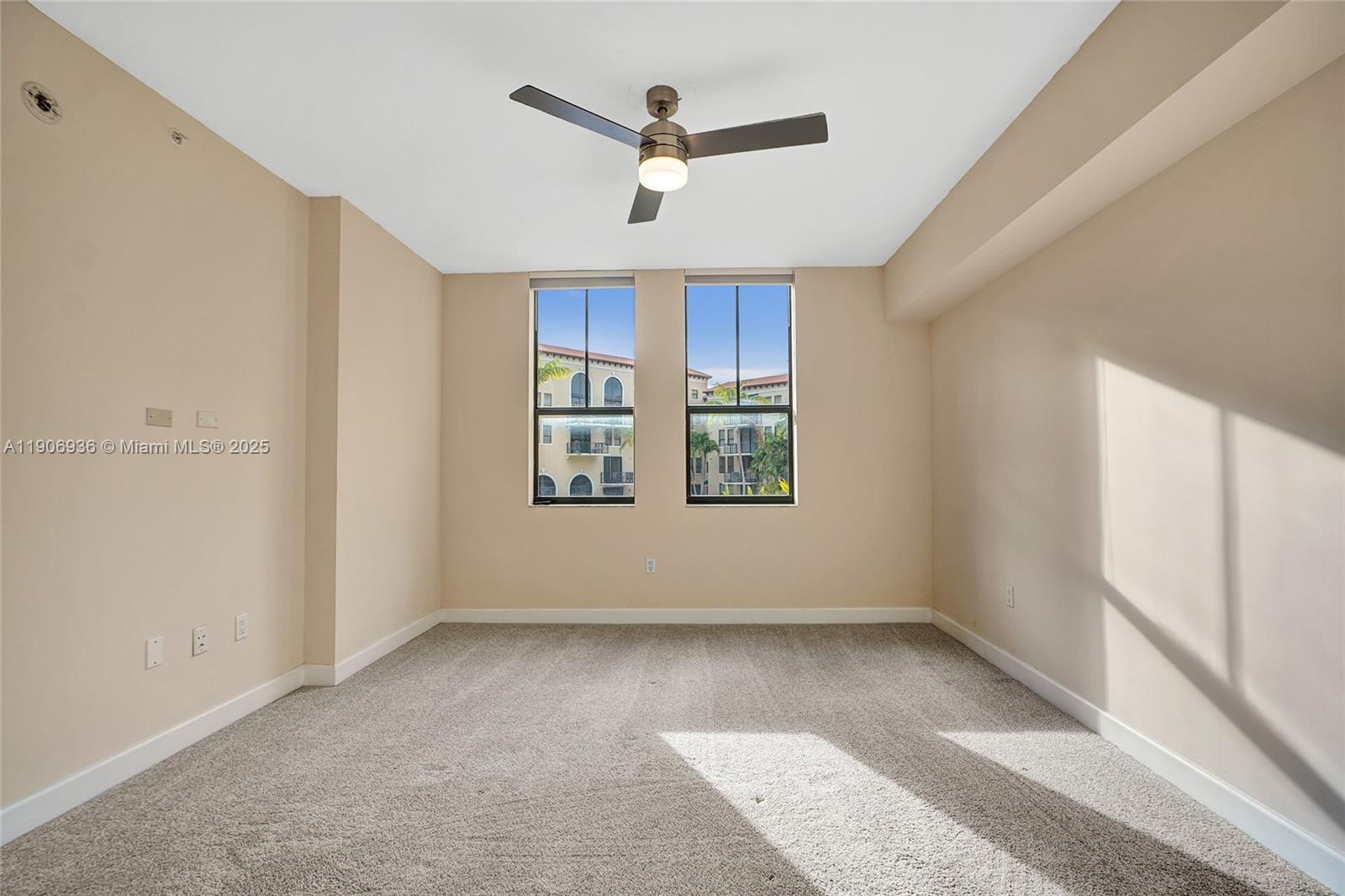 55 Merrick Way, Unit 619 Coral Gables, FL 33134 - Photo 19 of 40 a view of room with window and ceiling fan