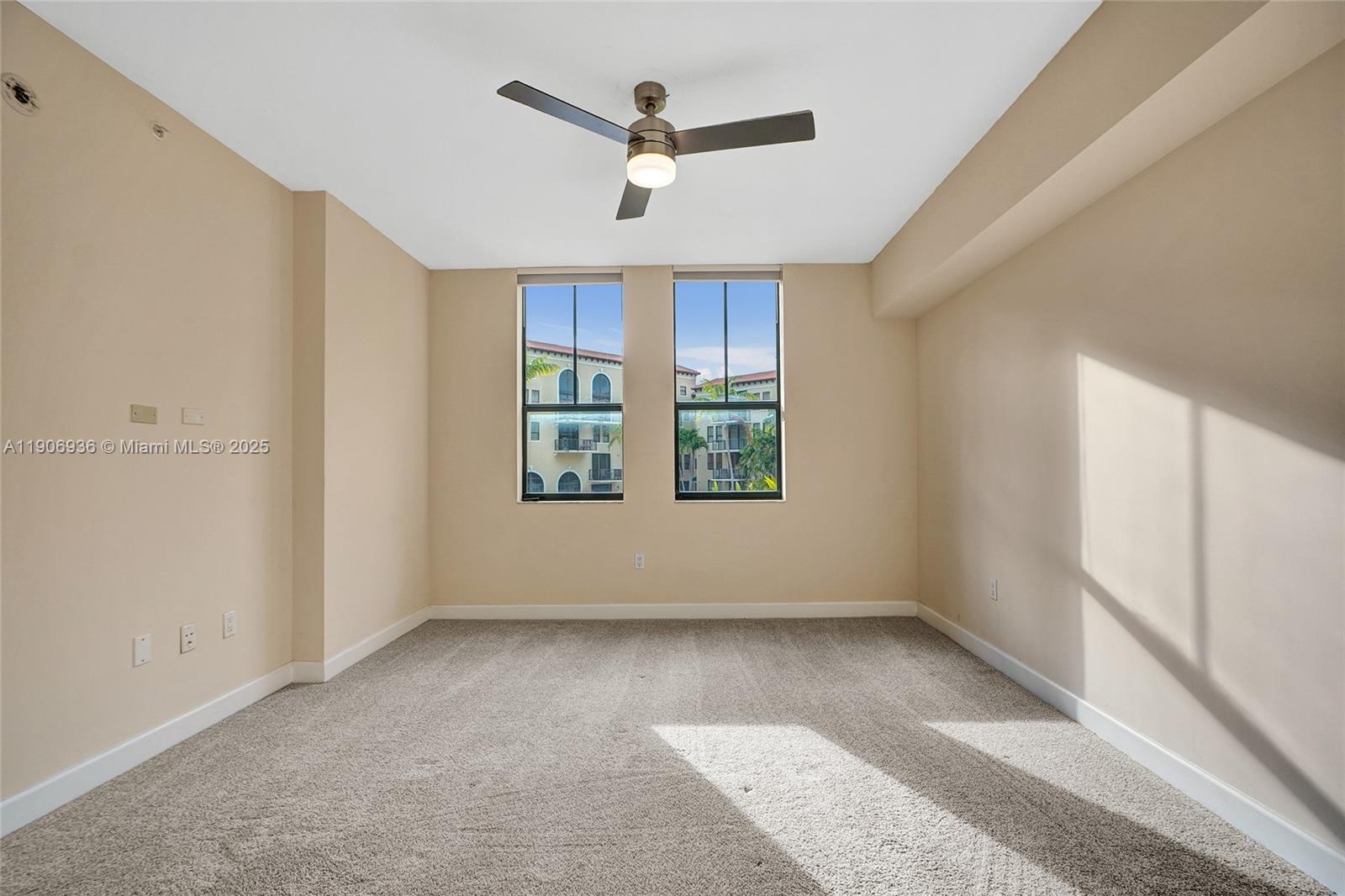 55 Merrick Way, Unit 619 Coral Gables, FL 33134 - Photo 23 of 40 a view of room with window and ceiling fan