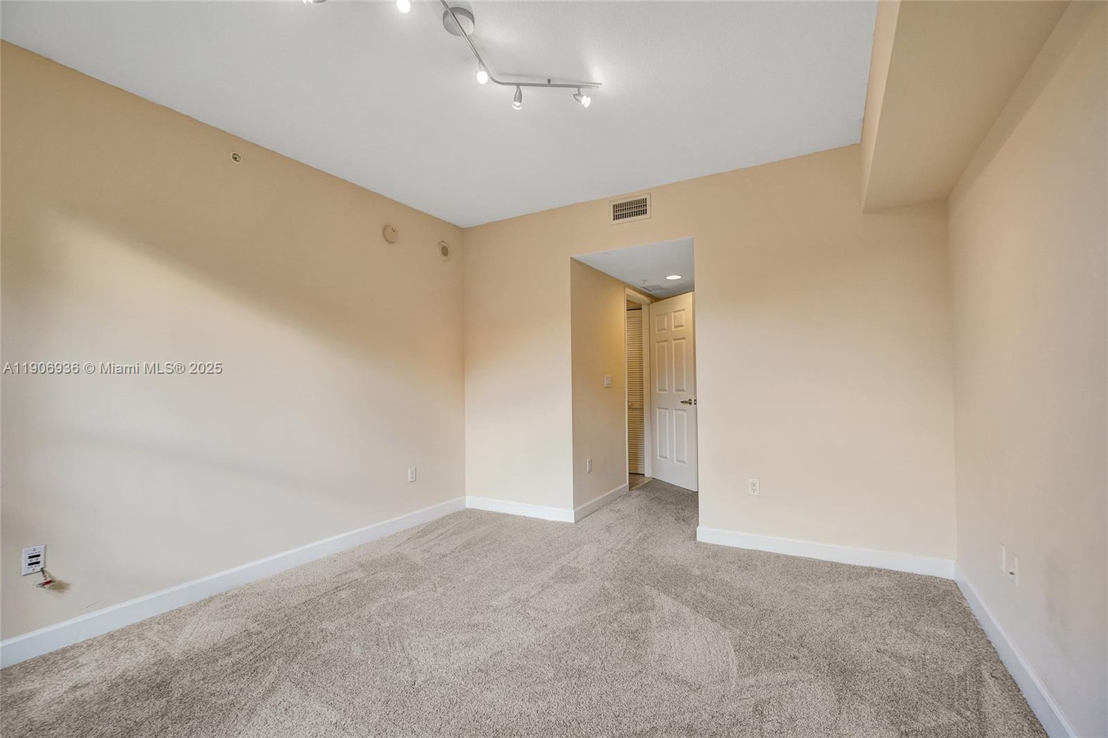 55 Merrick Way, Unit 619 Coral Gables, FL 33134 - Photo 30 of 40 wooden floor in an empty room