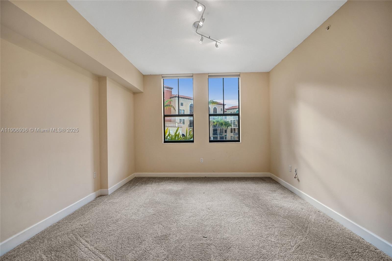 55 Merrick Way, Unit 619 Coral Gables, FL 33134 - Photo 32 of 40 an empty room with windows