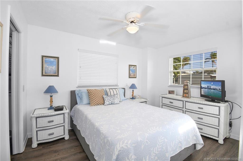 10725 South Ocean Drive, Unit 214 Jensen Beach, FL 34957 - Photo 22 of 90 a bedroom with a bed and a flat screen tv