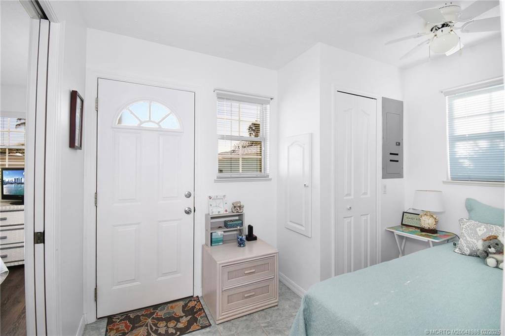10725 South Ocean Drive, Unit 214 Jensen Beach, FL 34957 - Photo 27 of 90 a bedroom with a bed and a dresser