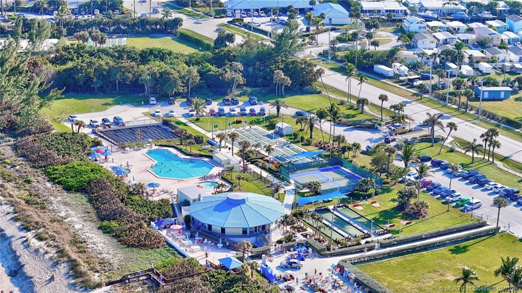 10725 South Ocean Drive, Unit 214 Jensen Beach, FL 34957 - Photo 55 of 90 an aerial view of residential houses with outdoor space