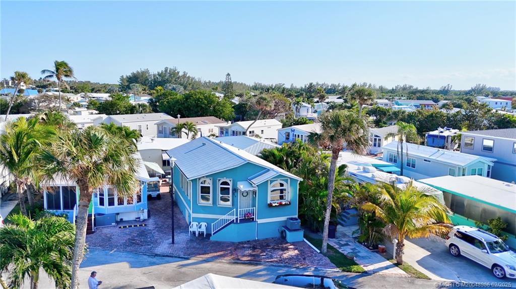 10725 South Ocean Drive, Unit 214 Jensen Beach, FL 34957 - Photo 7 of 90 a view of a house with a swimming pool and sitting area