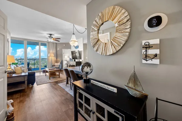 a kitchen with stainless steel appliances granite countertop a refrigerator a stove top oven a sink and dishwasher