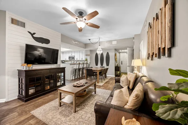 a living room with furniture and a flat screen tv