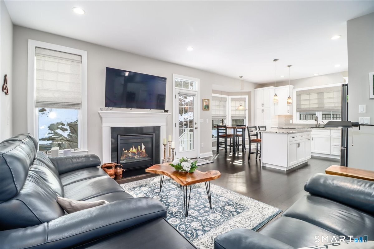 32 Hunting Ridge Lane, Unit 32 Bethel, CT 06801 - Photo 11 of 39 a living room with furniture and a fireplace