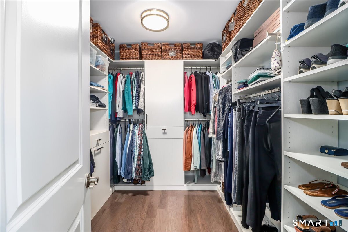 32 Hunting Ridge Lane, Unit 32 Bethel, CT 06801 - Photo 20 of 39 a view of walk in closet with clothes and shoes
