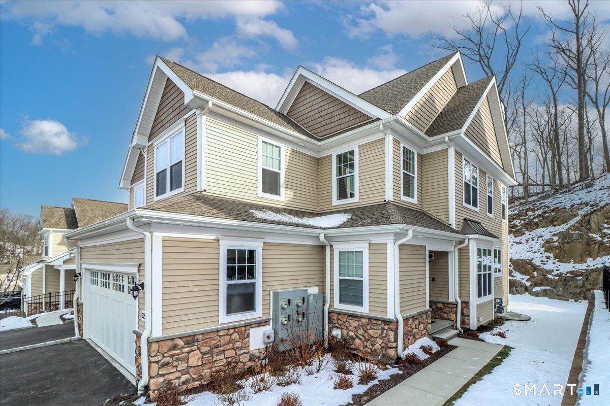 32 Hunting Ridge Lane, Unit 32 Bethel, CT 06801 - Photo 2 of 39 a front view of a house with yard