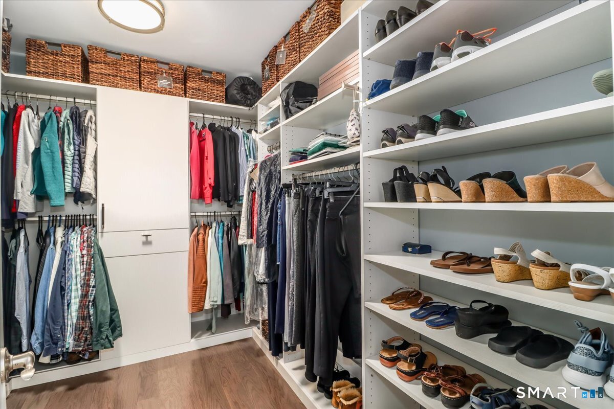 32 Hunting Ridge Lane, Unit 32 Bethel, CT 06801 - Photo 21 of 39 a view of walk in closet with clothes and shoes