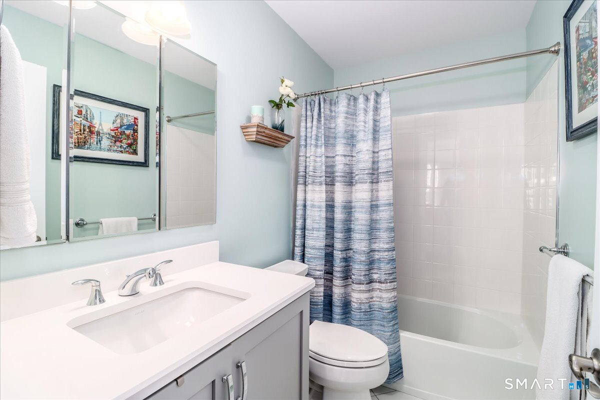 32 Hunting Ridge Lane, Unit 32 Bethel, CT 06801 - Photo 27 of 39 a bathroom with a sink a toilet and shower