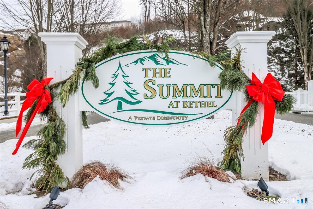32 Hunting Ridge Lane, Unit 32 Bethel, CT 06801 - Photo 5 of 39 a front view of a house with a swimming pool
