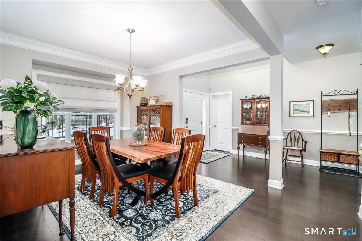 32 Hunting Ridge Lane, Unit 32 Bethel, CT 06801 - Photo 6 of 39 a view of a dining room with furniture window and wooden floor