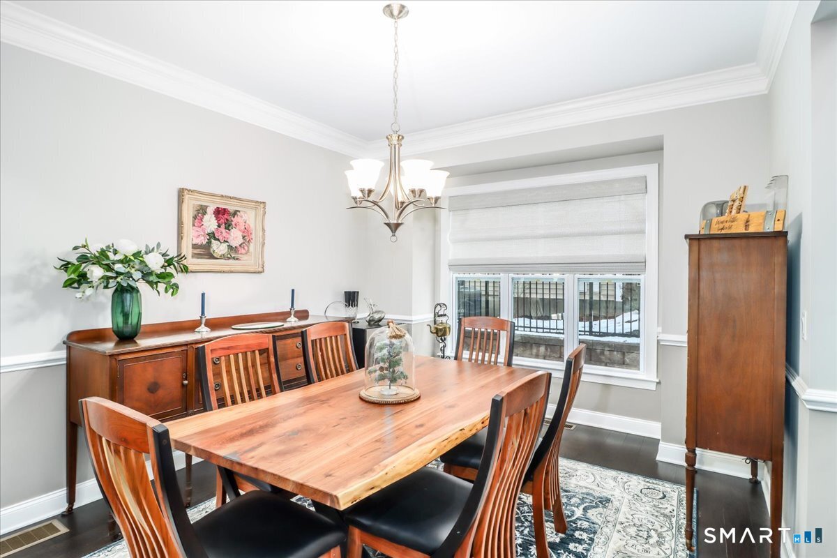 32 Hunting Ridge Lane, Unit 32 Bethel, CT 06801 - Photo 8 of 39 a view of a dining room with furniture window and outside view