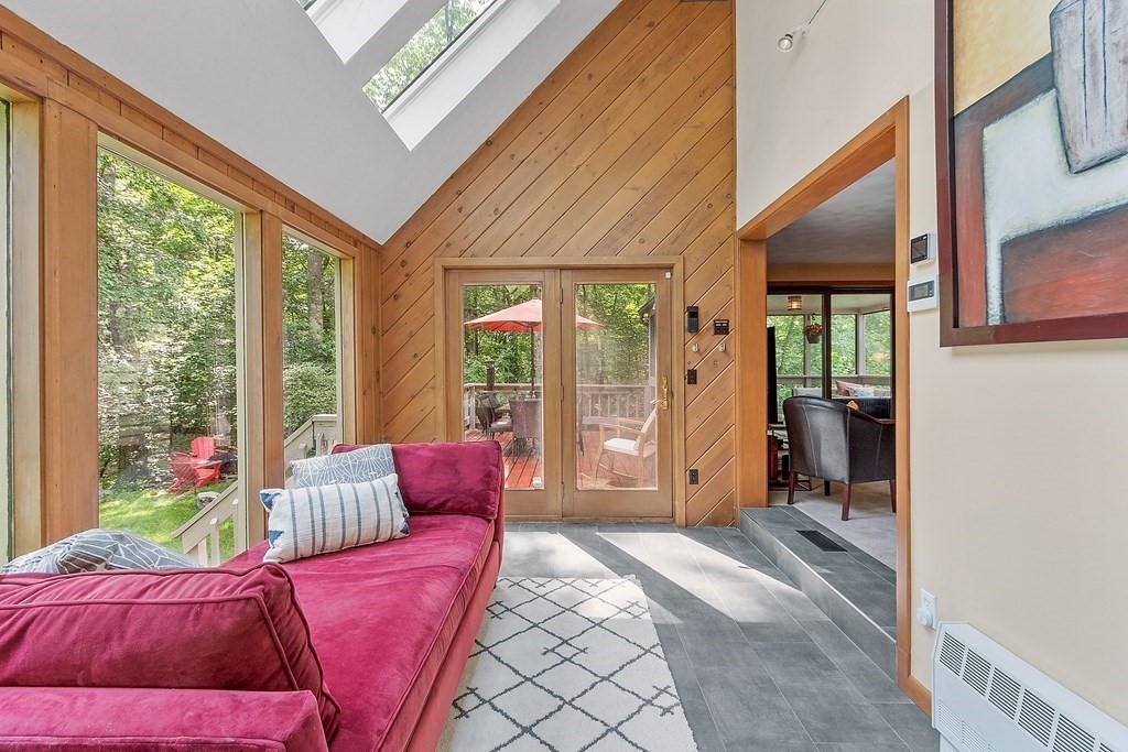 377 Sargent Road Boxborough, MA 01719 - Photo 11 of 42 a living room with furniture and a large window