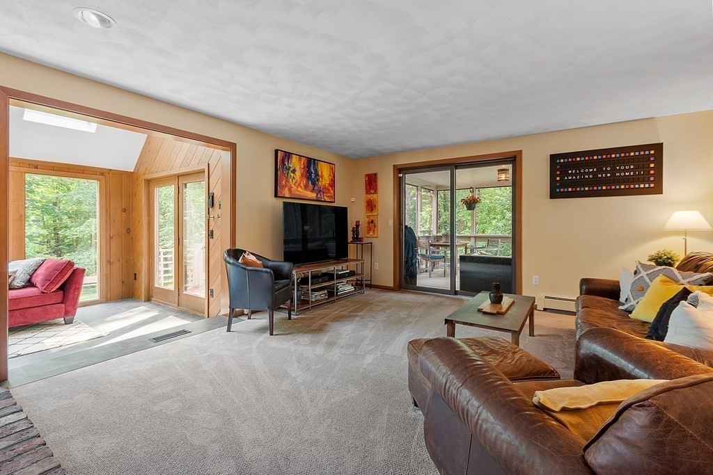377 Sargent Road Boxborough, MA 01719 - Photo 12 of 42 a living room with furniture and a flat screen tv
