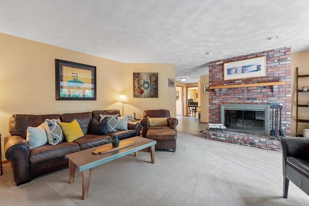 377 Sargent Road Boxborough, MA 01719 - Photo 13 of 42 a living room with furniture and a fireplace