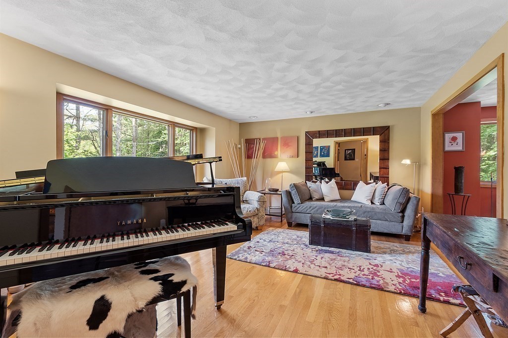 377 Sargent Road Boxborough, MA 01719 - Photo 16 of 42 a living room with furniture and a piano