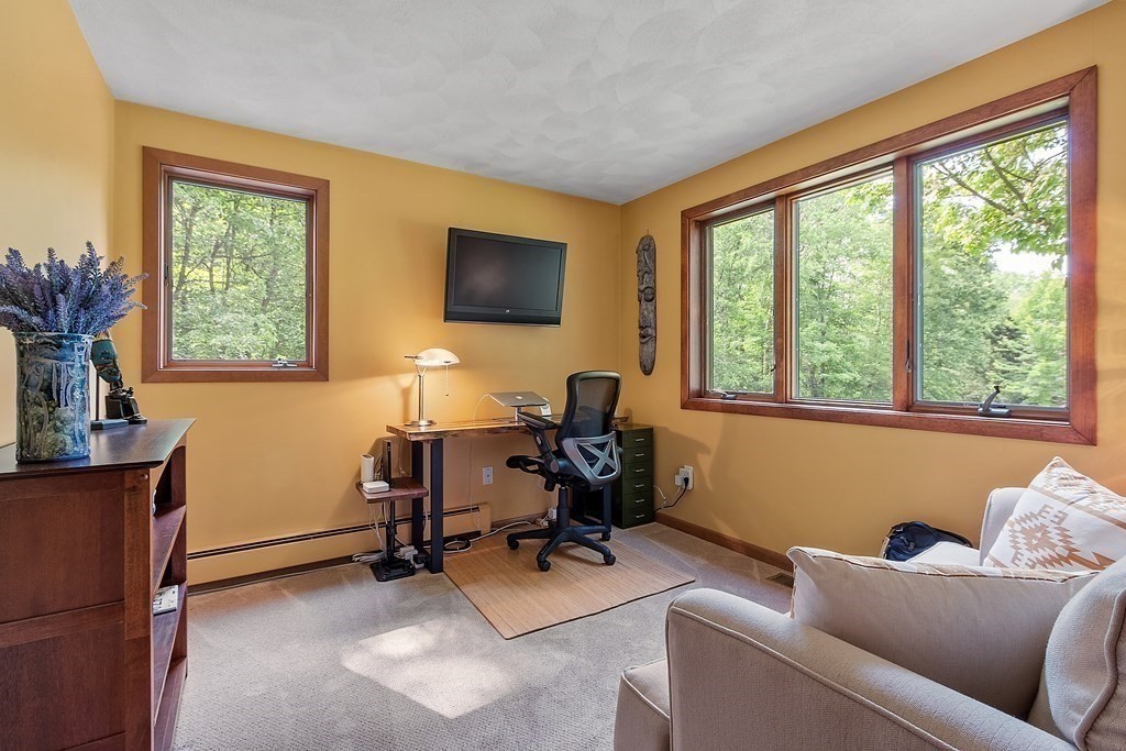 377 Sargent Road Boxborough, MA 01719 - Photo 18 of 42 a living room with furniture and a flat screen tv