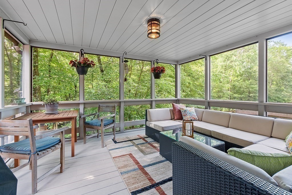 377 Sargent Road Boxborough, MA 01719 - Photo 20 of 42 a living room with furniture and a floor to ceiling window