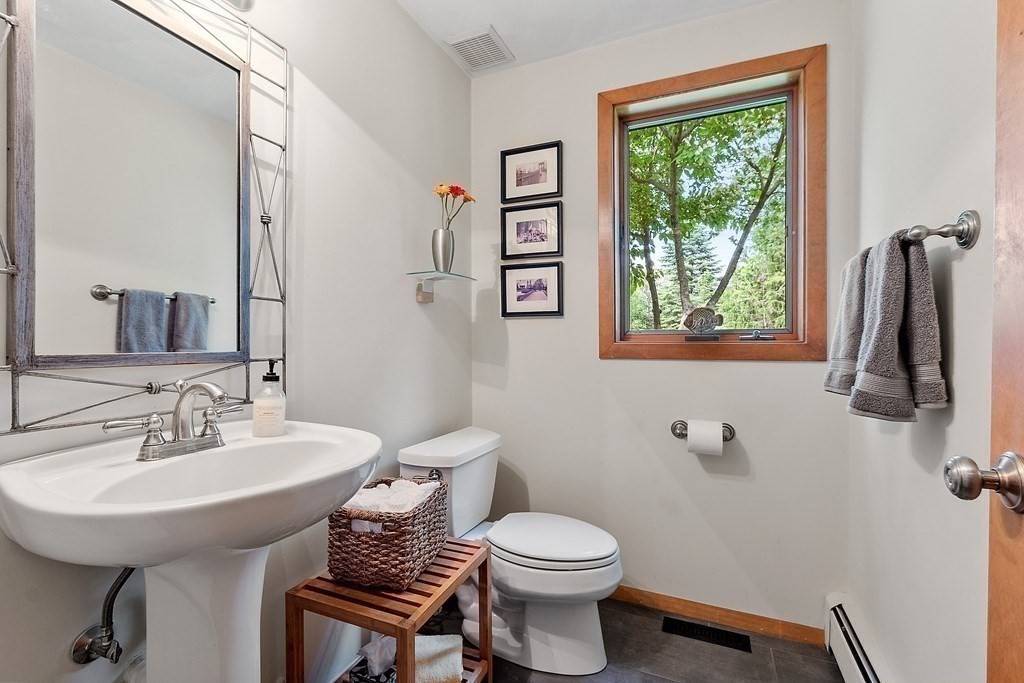 377 Sargent Road Boxborough, MA 01719 - Photo 23 of 42 a bathroom with a sink toilet and a mirror