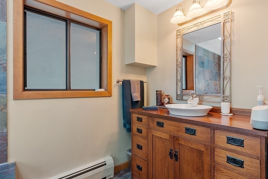 377 Sargent Road Boxborough, MA 01719 - Photo 30 of 42 a bathroom with a sink and a mirror