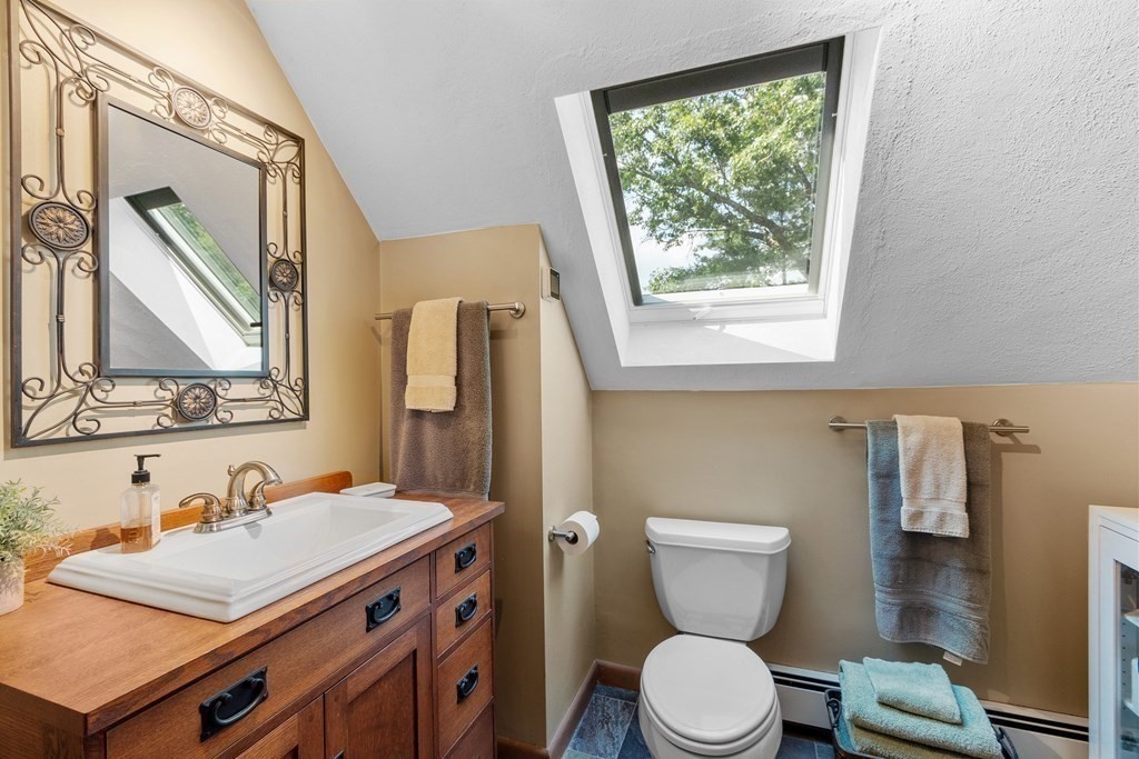 377 Sargent Road Boxborough, MA 01719 - Photo 34 of 42 a bathroom with a toilet sink and mirror