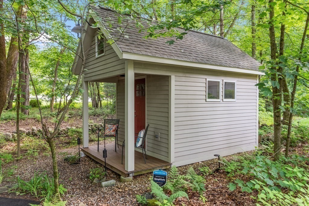 377 Sargent Road Boxborough, MA 01719 - Photo 37 of 42 a view of a house with a yard