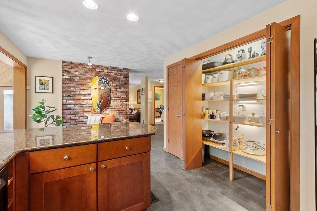 377 Sargent Road Boxborough, MA 01719 - Photo 7 of 42 a kitchen with stainless steel appliances granite countertop a refrigerator and a sink