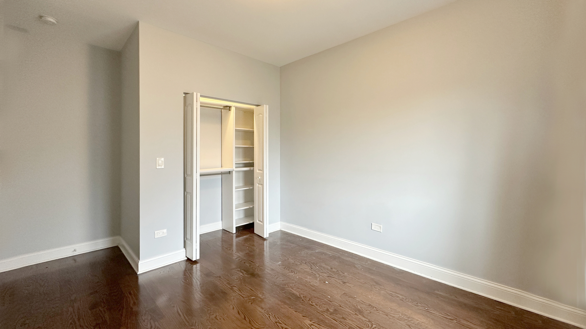 1538 West 34th Street, Unit E Chicago, IL 60608 - Photo 24 of 33 an empty room with wooden floor and a window