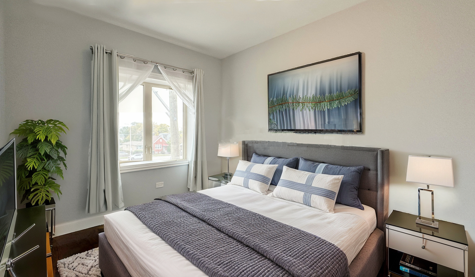 1538 West 34th Street, Unit E Chicago, IL 60608 - Photo 26 of 33 a bedroom with a bed and a painting on the wall