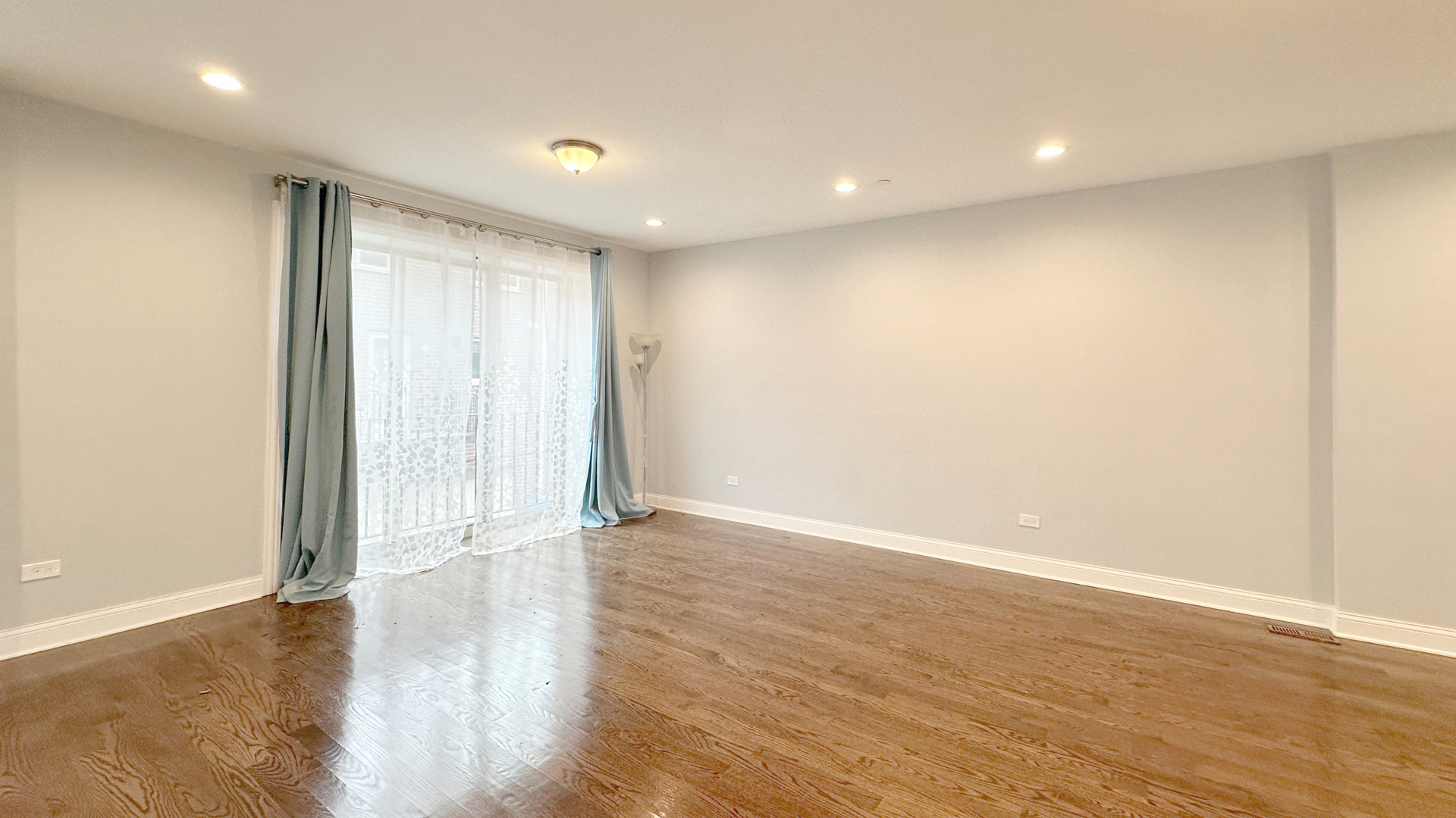 1538 West 34th Street, Unit E Chicago, IL 60608 - Photo 9 of 33 a view of an empty room with wooden floor