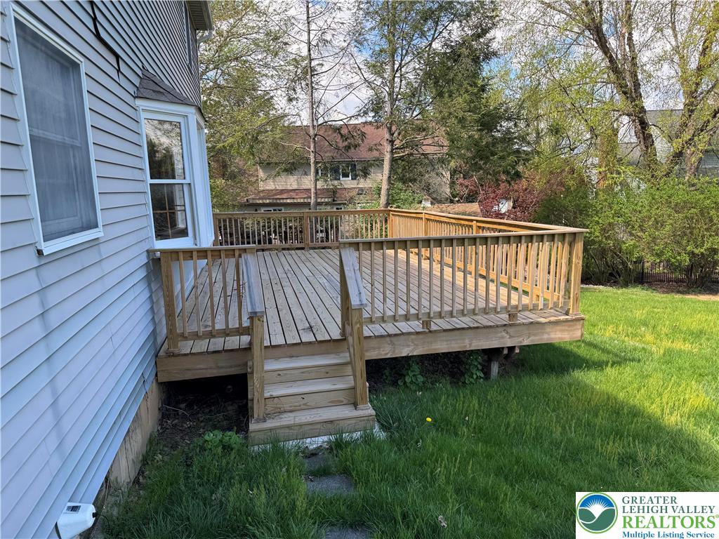 1929 Earls Court Allentown, PA 18103 - Photo 15 of 20 This spacious wooden deck offers abundant outdoor living space, perfect for entertaining or relaxation.