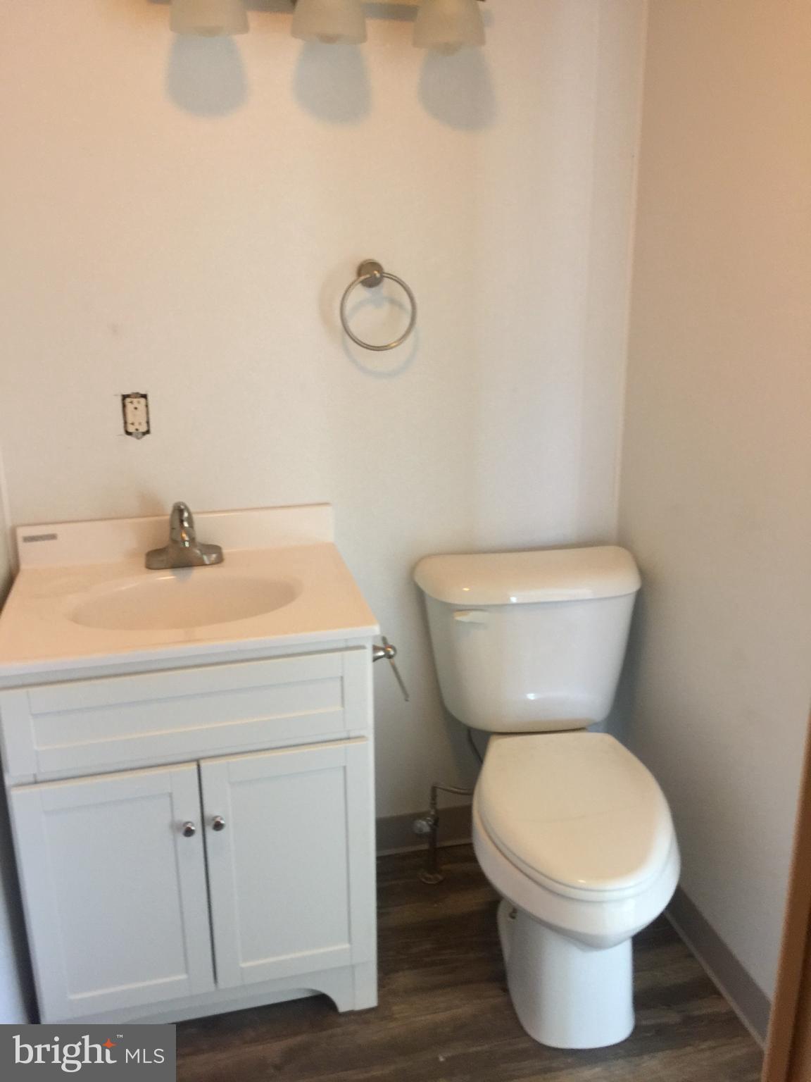 624 East Middle Street Hanover, PA 17331 - Photo 11 of 15 a bathroom with a toilet sink and mirror