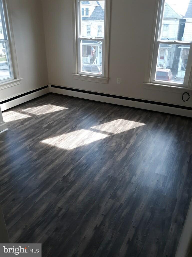 624 East Middle Street Hanover, PA 17331 - Photo 14 of 15 a view of an empty room with wooden floor and a window