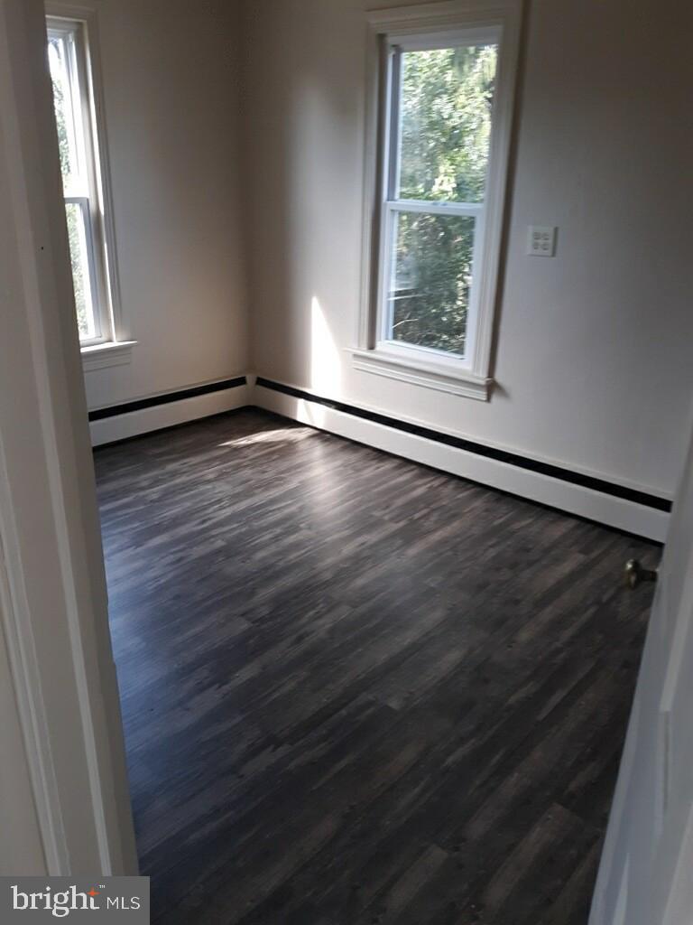 624 East Middle Street Hanover, PA 17331 - Photo 15 of 15 an empty room with wooden floor and windows