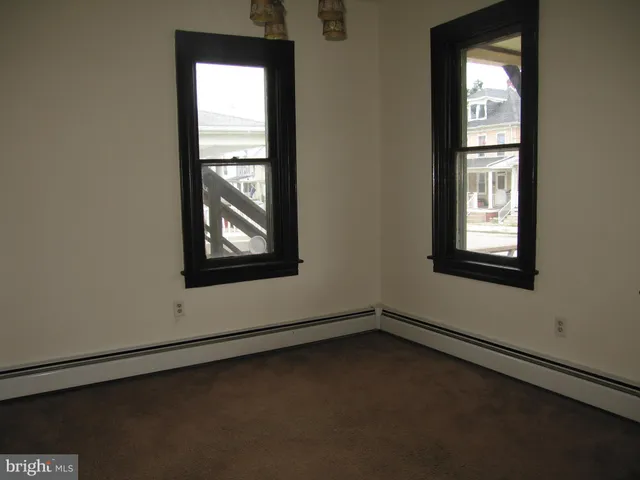 a view of a kitchen with a sink cabinets and a window