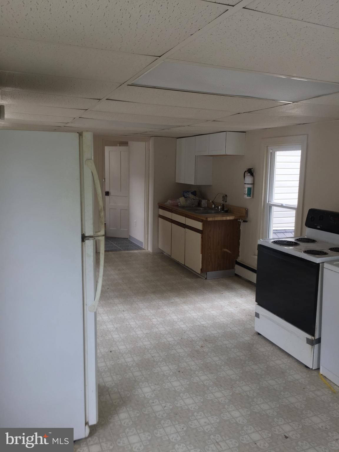 624 East Middle Street Hanover, PA 17331 - Photo 9 of 15 a kitchen with stainless steel appliances granite countertop a stove and a refrigerator