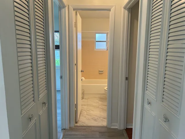 a view of a bathroom from a hallway