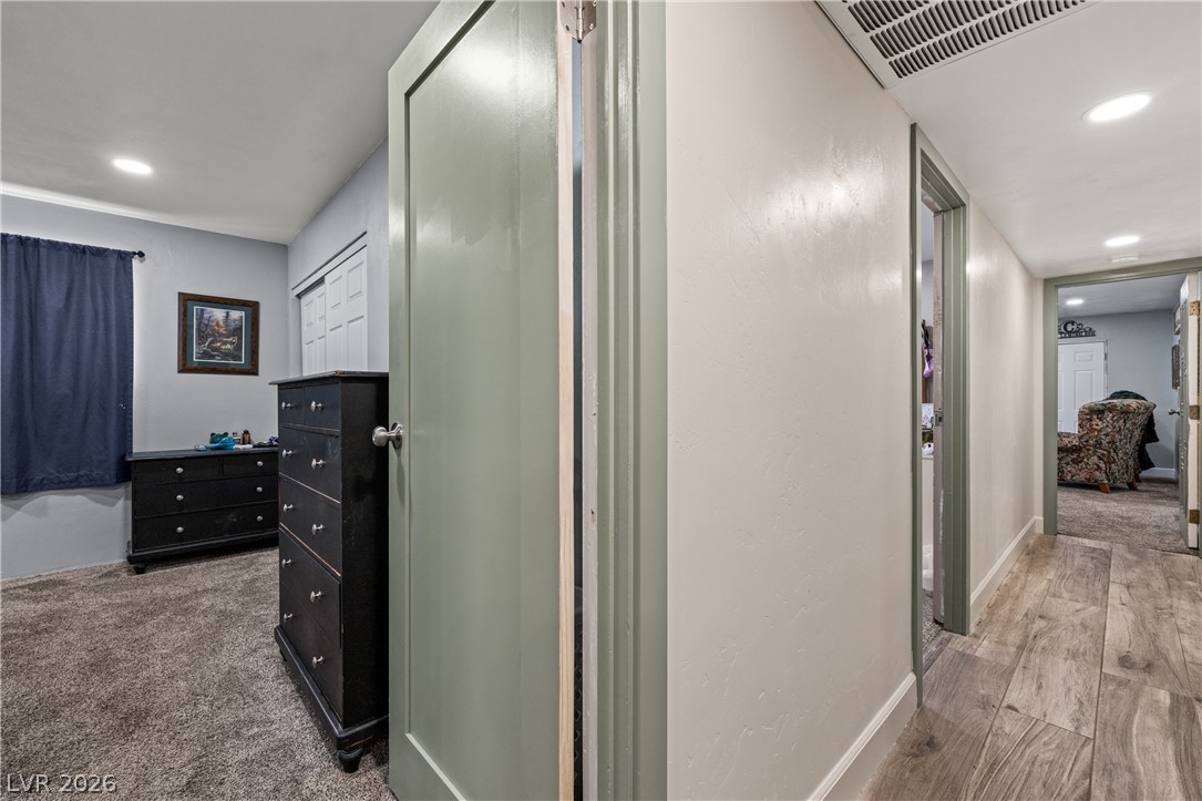 750 Leming Avenue Overton, NV 89040 - Photo 33 of 82 This interior hallway connects to a bedroom, offering a glimpse of comfortable living.