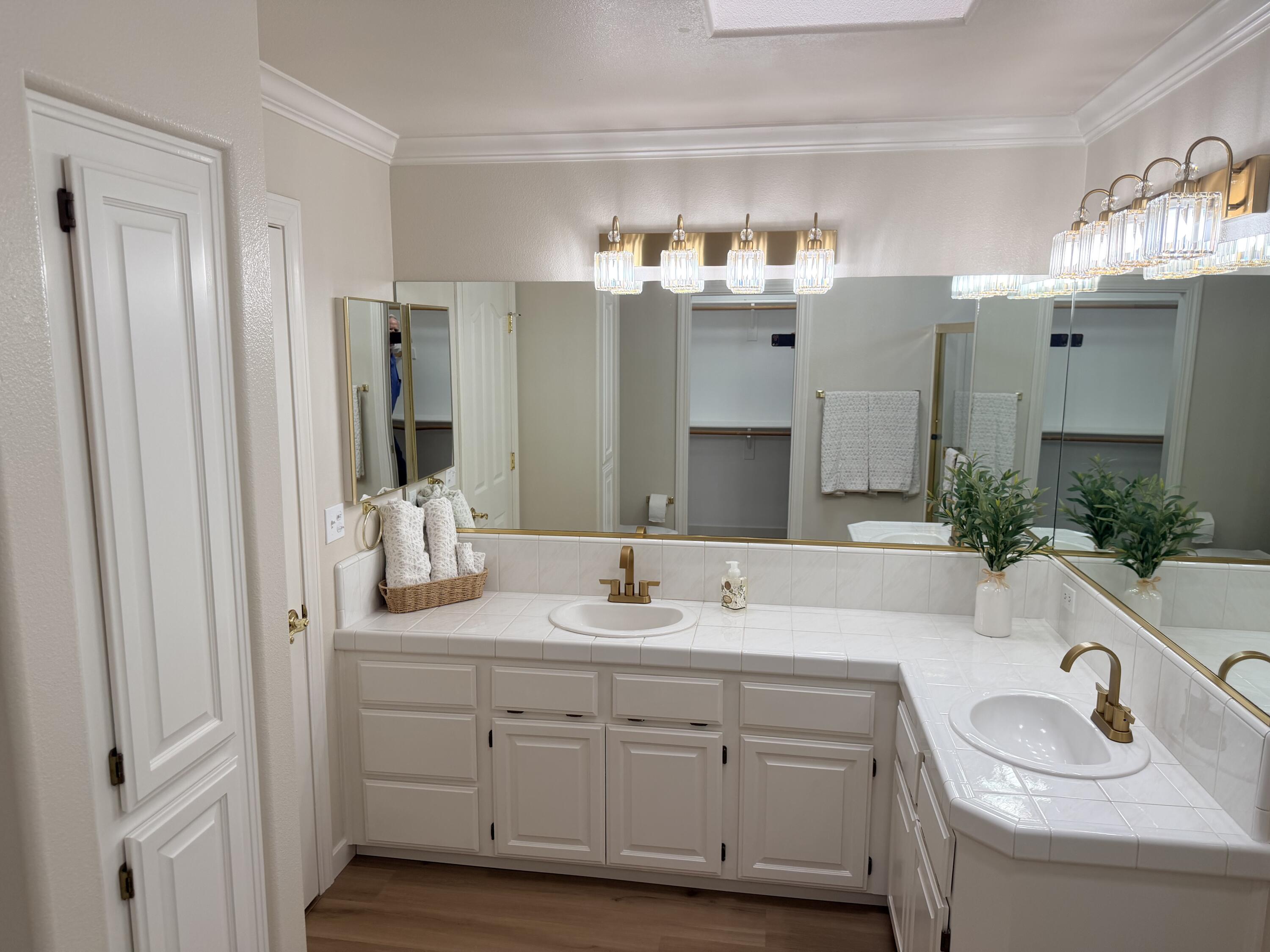 4365 Heather Ridge Lane Redding, CA 96001 - Photo 16 of 21 a bathroom with a sink double vanity granite and a mirror